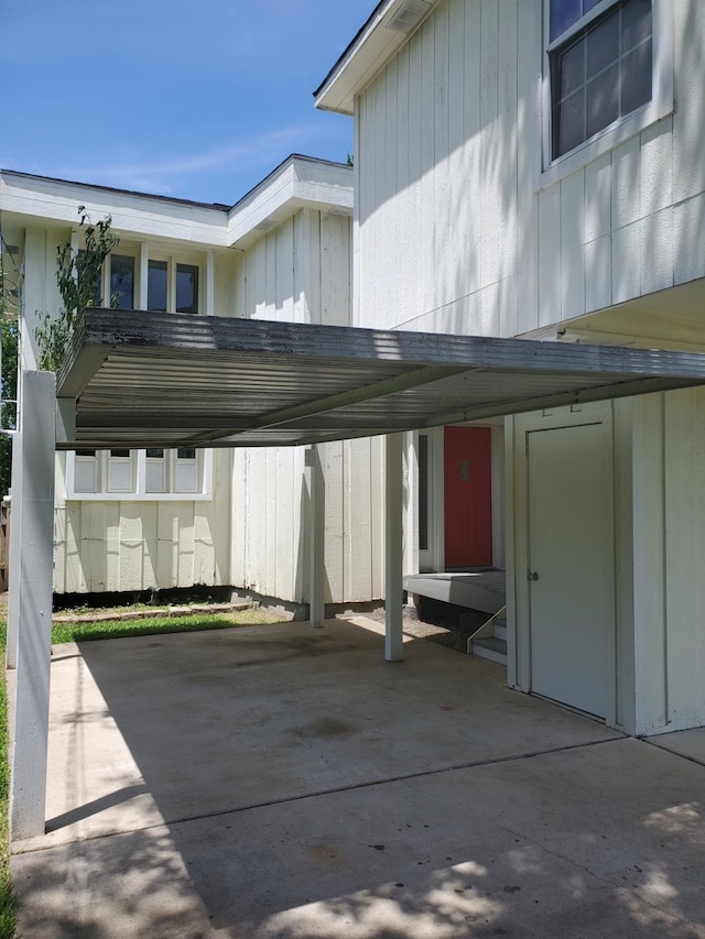 view of parking / parking lot featuring a carport