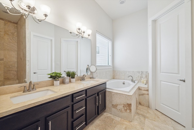 bathroom featuring a notable chandelier, dual vanity, tiled bath, and tile patterned flooring