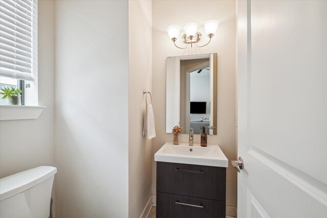 bathroom with toilet and vanity