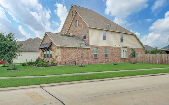 view of home's exterior with a lawn