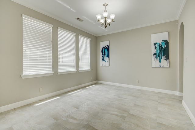 tiled spare room with a chandelier and ornamental molding