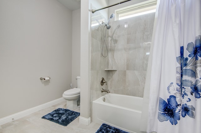 bathroom featuring shower / bath combo with shower curtain, tile patterned floors, and toilet