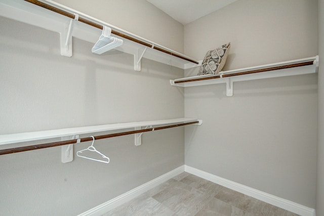 walk in closet featuring light tile patterned floors