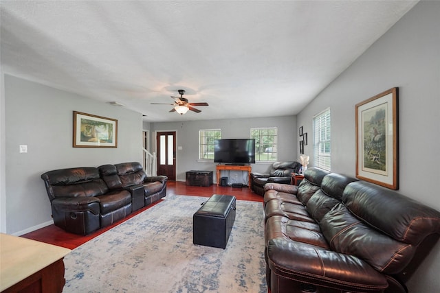 living room featuring hardwood / wood-style flooring and ceiling fan