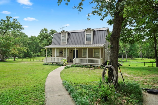 view of front facade featuring a front yard and a porch