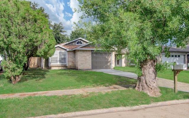 view of front of property featuring a garage and a front yard