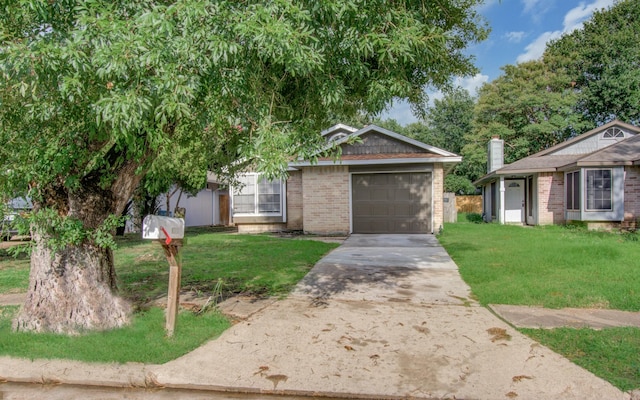 view of front of home with a garage and a front lawn