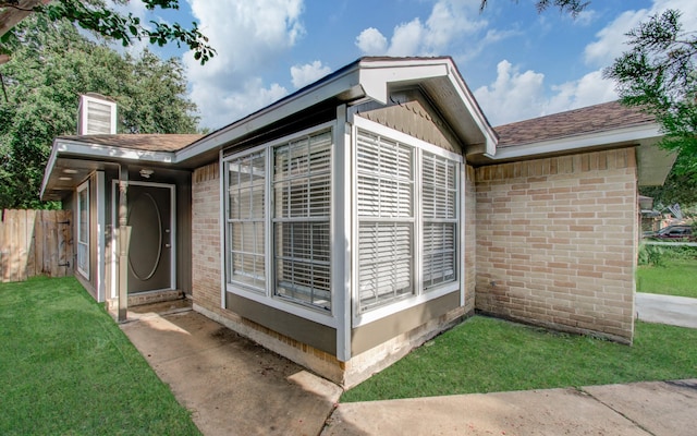 view of home's exterior featuring a yard