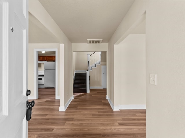 hallway featuring light wood-type flooring