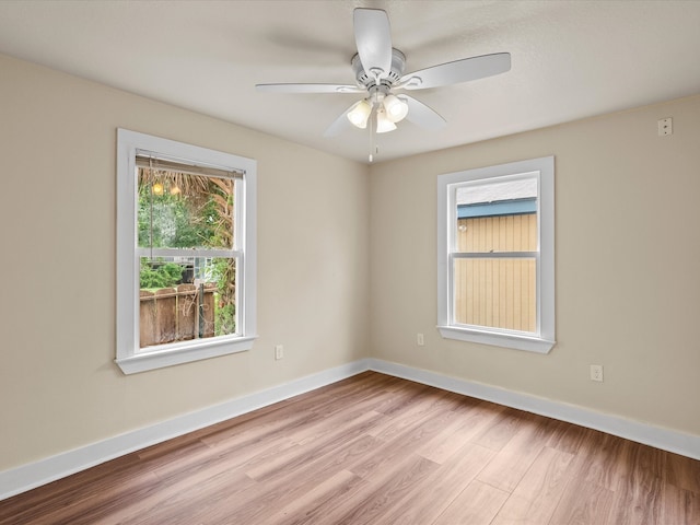 unfurnished room featuring ceiling fan and light hardwood / wood-style flooring