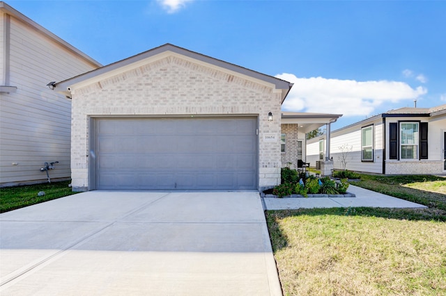 view of front facade featuring a garage and a front lawn