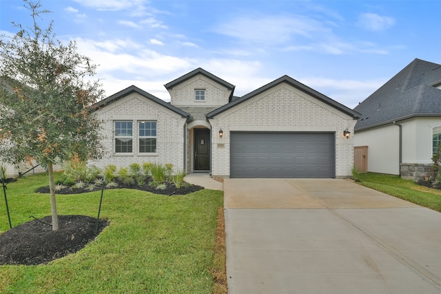 french country home with a garage and a front lawn