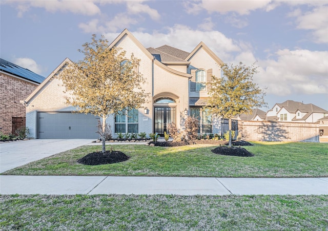 front of property featuring a balcony, a garage, and a front lawn