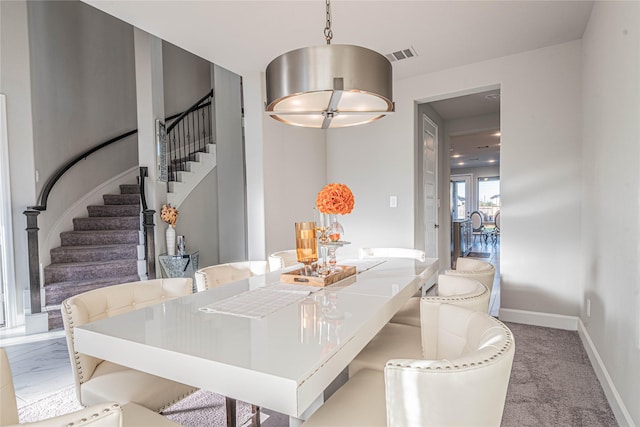 dining area with carpet flooring and french doors