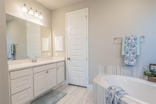 bathroom with vanity and a bathing tub