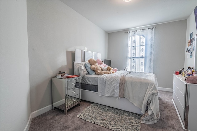 bedroom with dark carpet