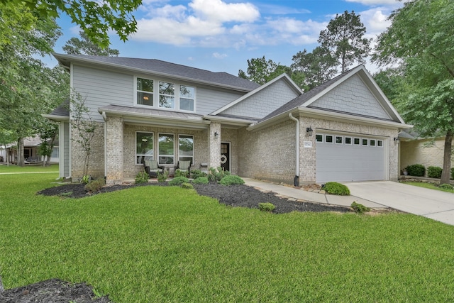 view of front of property with a porch, a garage, and a front lawn