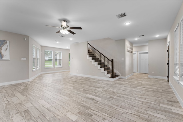 unfurnished living room with ceiling fan and light hardwood / wood-style flooring