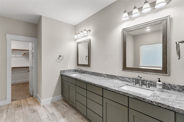 bathroom featuring vanity and wood-type flooring