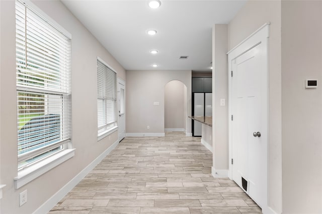 corridor featuring light hardwood / wood-style floors