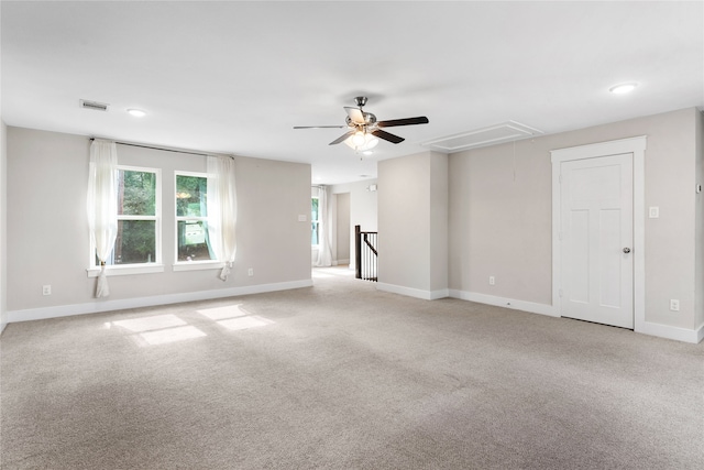 carpeted spare room with ceiling fan