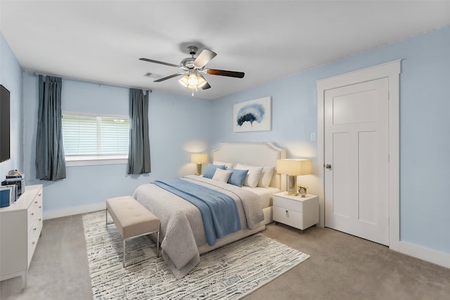 carpeted bedroom with ceiling fan