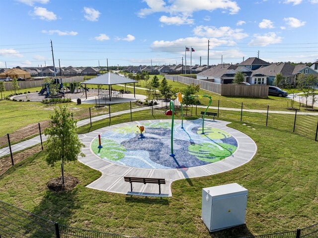 view of property's community featuring a gazebo, a lawn, and a playground