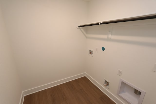 laundry room with gas dryer hookup, dark wood-type flooring, electric dryer hookup, and washer hookup