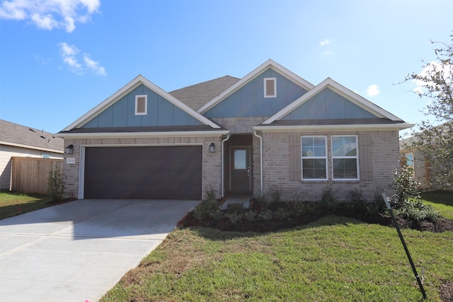 view of front facade featuring a front yard and a garage