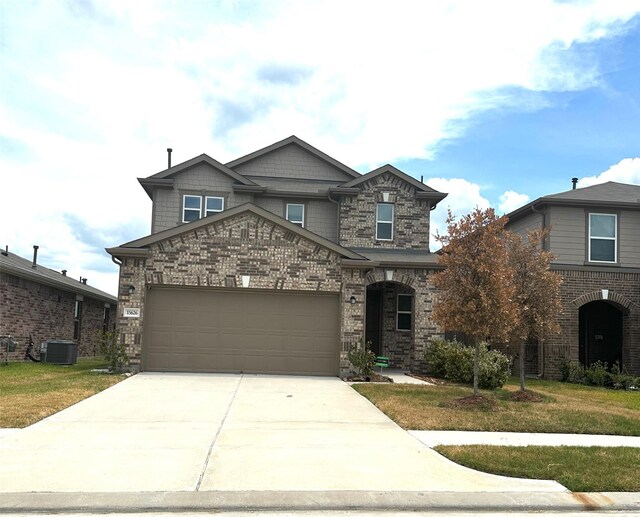 view of front of property with cooling unit and a front lawn