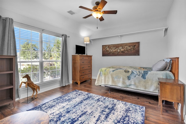 bedroom featuring ceiling fan and dark wood-type flooring