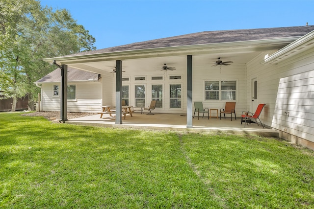 rear view of house featuring a patio, a lawn, and ceiling fan