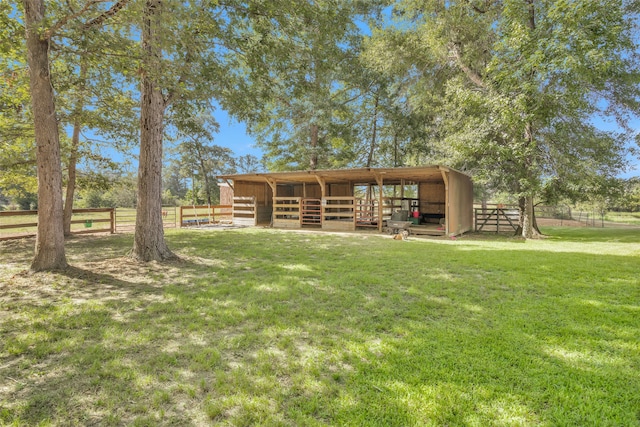 exterior space featuring an outbuilding and a front yard