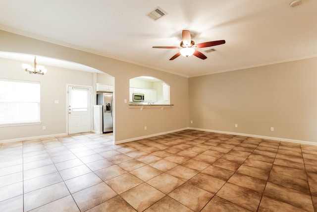 tiled empty room with ornamental molding and ceiling fan with notable chandelier