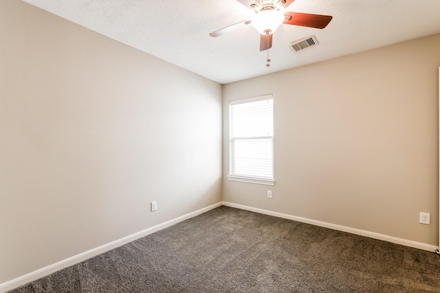 spare room featuring carpet floors and ceiling fan