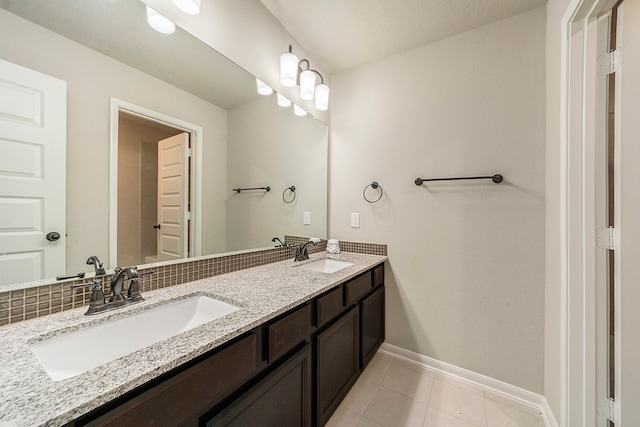 bathroom with dual vanity and tile patterned floors