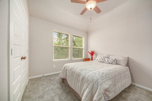 bedroom featuring ceiling fan, lofted ceiling, and carpet flooring