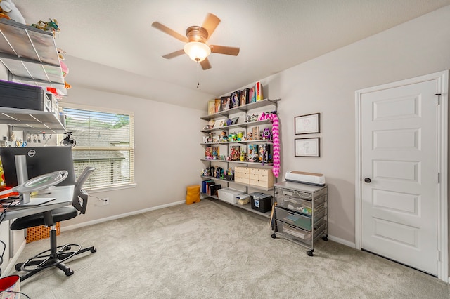 home office with ceiling fan and carpet flooring