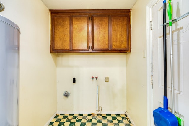 washroom featuring cabinets and electric dryer hookup