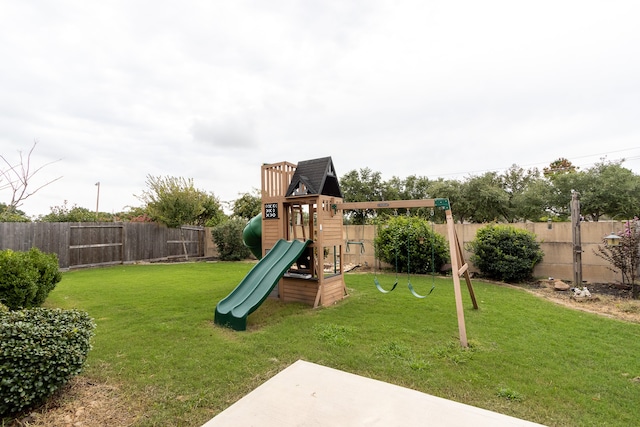 view of jungle gym featuring a lawn