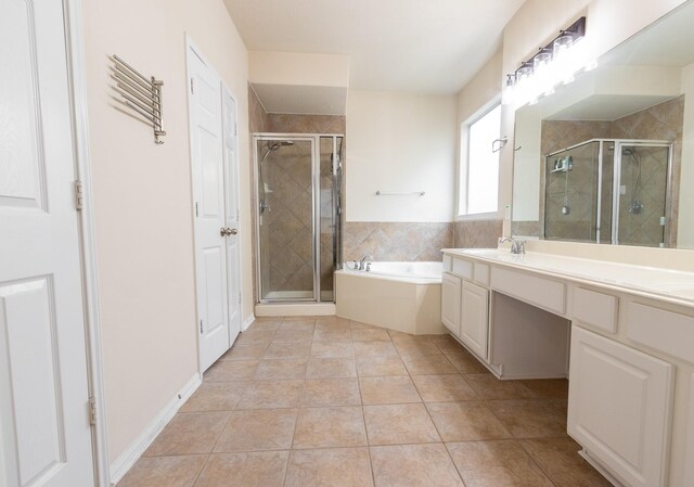 bathroom featuring vanity, tile patterned flooring, and separate shower and tub