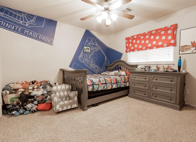 carpeted bedroom with ceiling fan