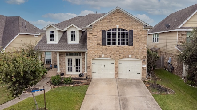 view of front of home with a garage and a front yard