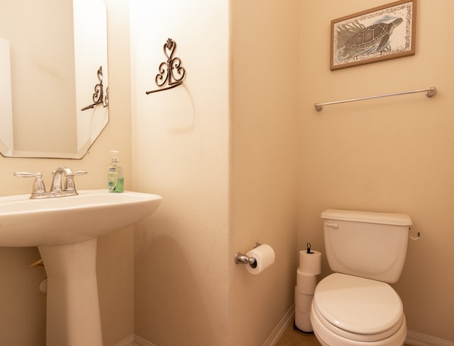 bathroom with sink and toilet