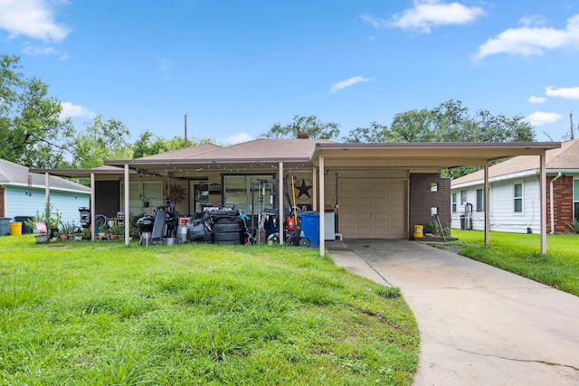 view of front of property with a garage, a carport, and a front yard