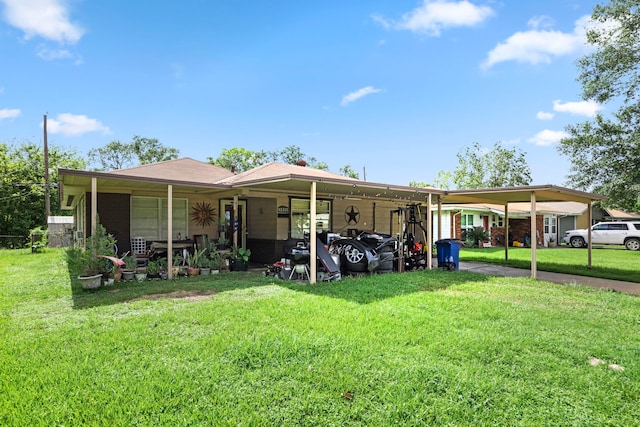 exterior space with a carport and a yard