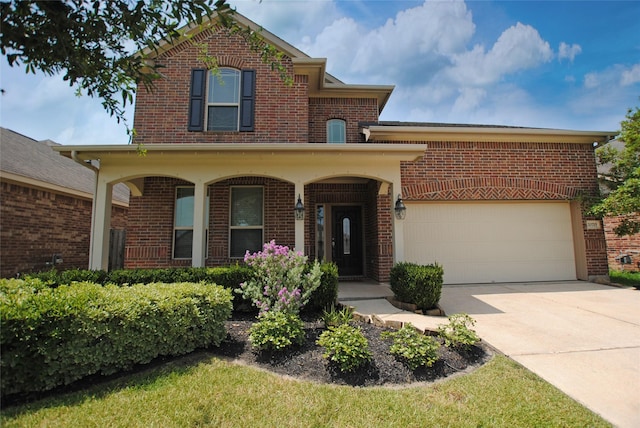 front of property with a porch and a garage