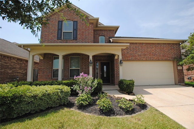 front facade featuring a garage and covered porch