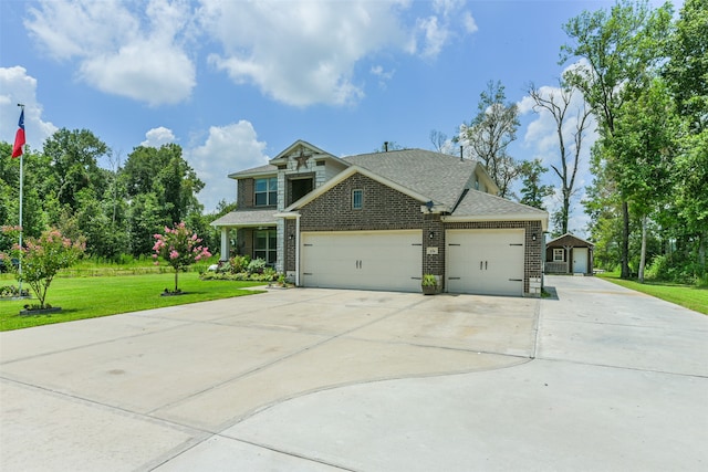 view of front facade with a garage and a front lawn