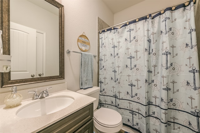 bathroom featuring a shower with curtain, vanity, and toilet